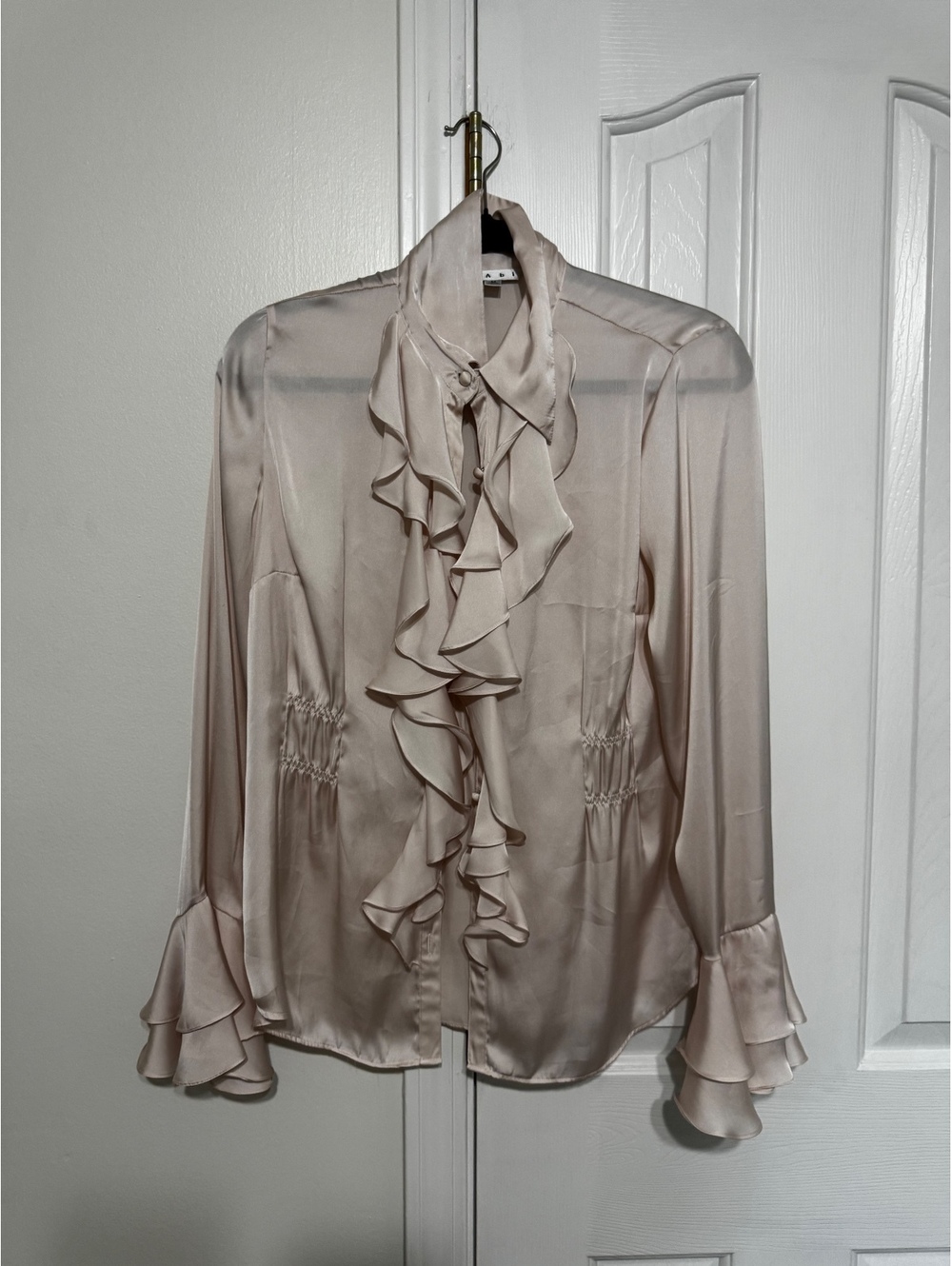 CAbi Women’s Blouse Size M Champagne Satin Ruffle Front Bell Sleeve Romantic Top